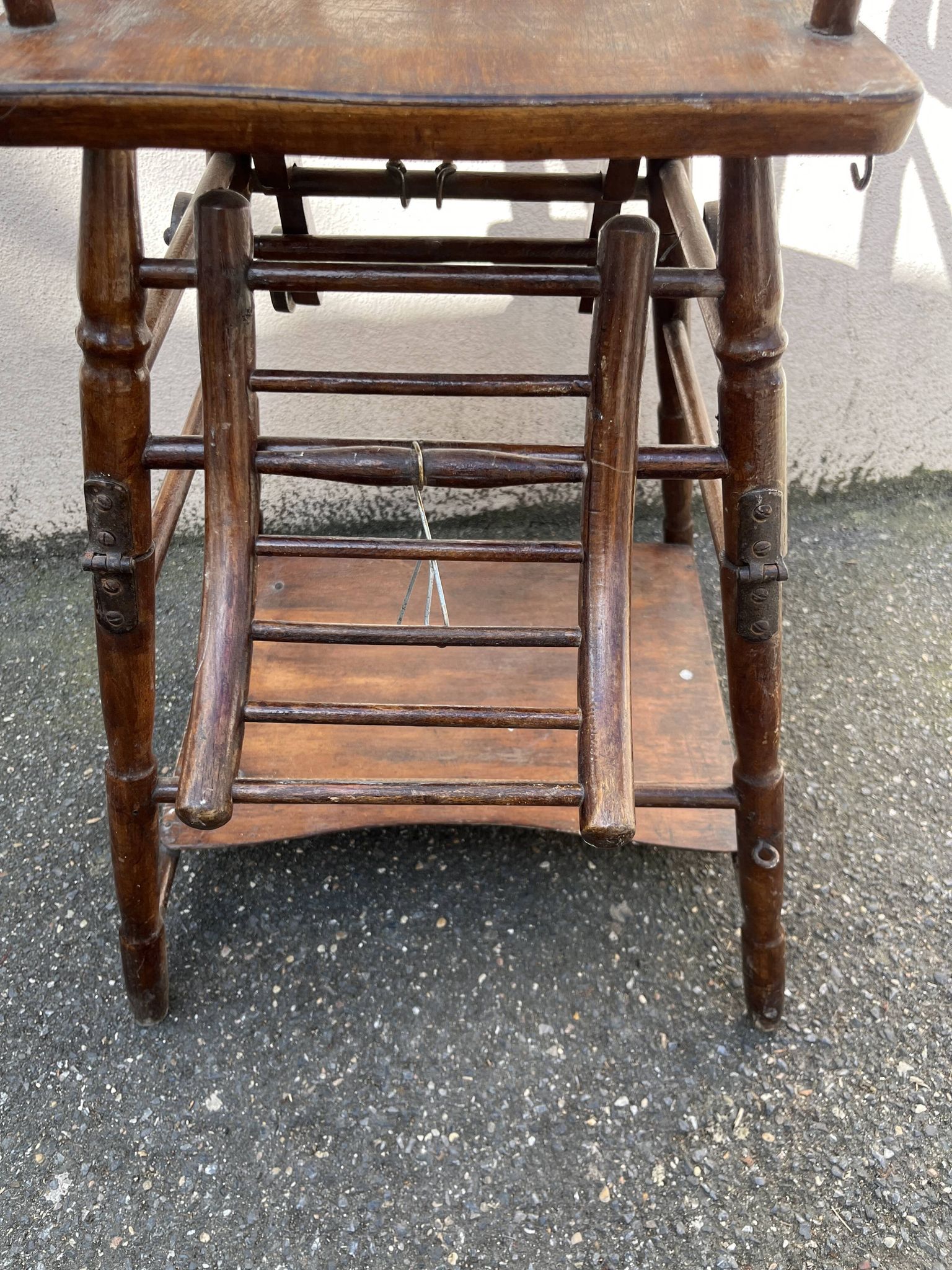 Wooden baby high chair convertible into a small desk from the 1950s