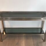 Beautiful console table in brushed metal with bluish glass shelves