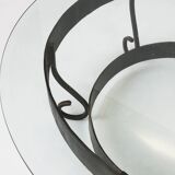Rustic round coffee table with wrought iron base and glass top, France, 1930s