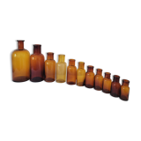 11 bottles of amber glass apothecary