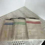 Three new multicoloured tea towels made of Cholet fabric, 100% cotton.