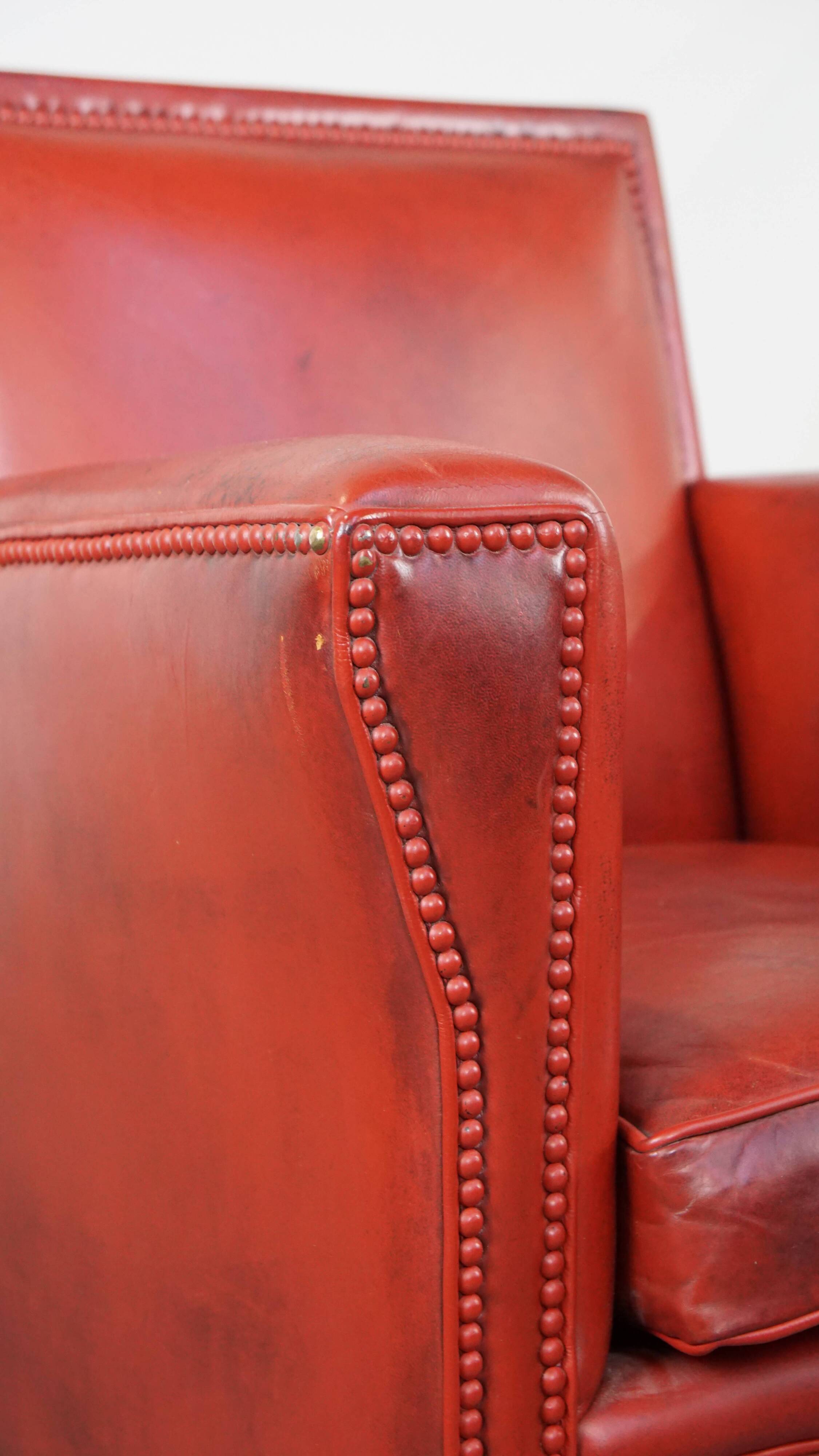 Red-painted armchair made of sheepskin leather