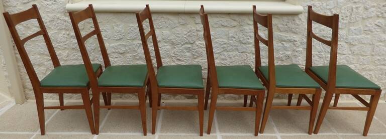6 modern chairs with banded backs and green faux leather seats