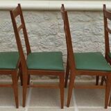 6 modern chairs with banded backs and green faux leather seats