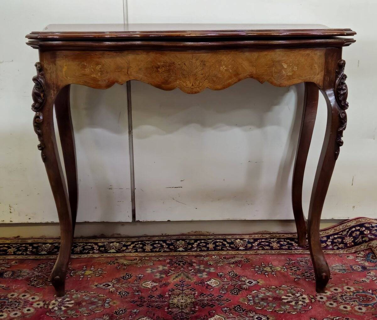 Louis XV style game table in marquetry and mahogany.
