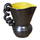 Ceramic jug with a twisted handle
