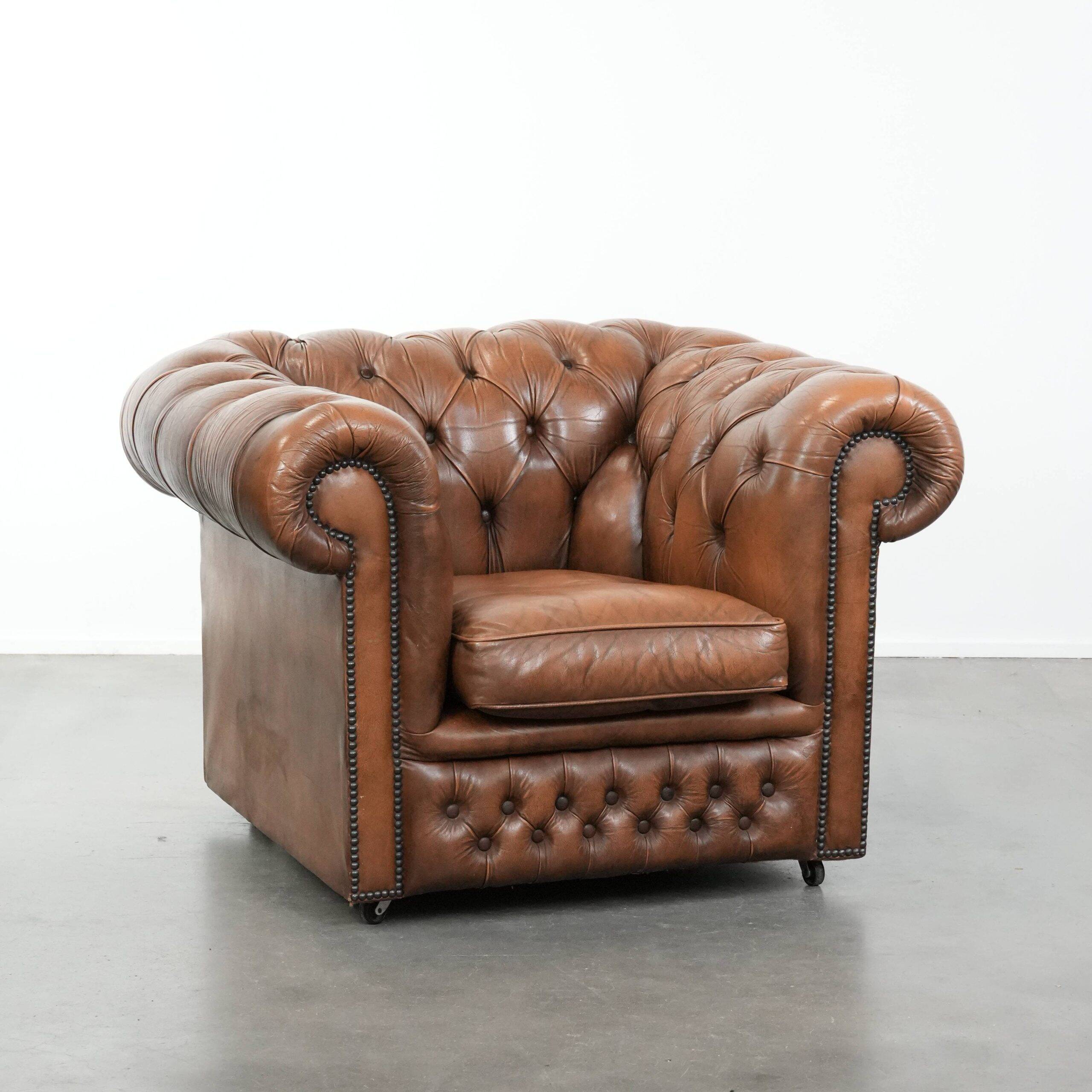 Brown cowhide leather chesterfield armchair  in English style on wheels