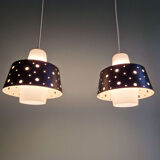 A pair of Scandinavian pendant lights in white opaline and black lacquered metal, 1960.