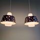 A pair of Scandinavian pendant lights in white opaline and black lacquered metal, 1960.