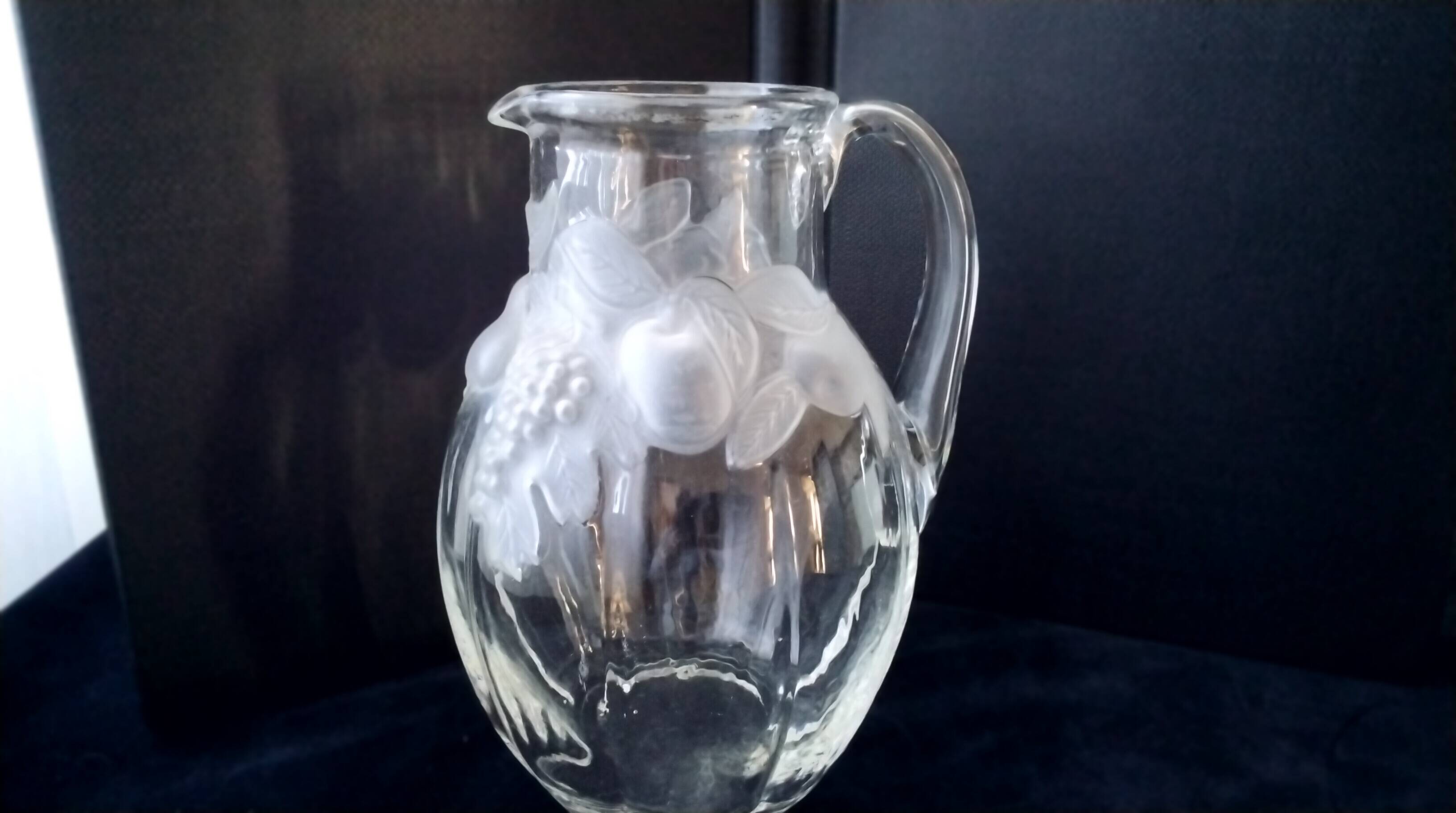 Large water jug with embossed fruit decoration in frosted glass