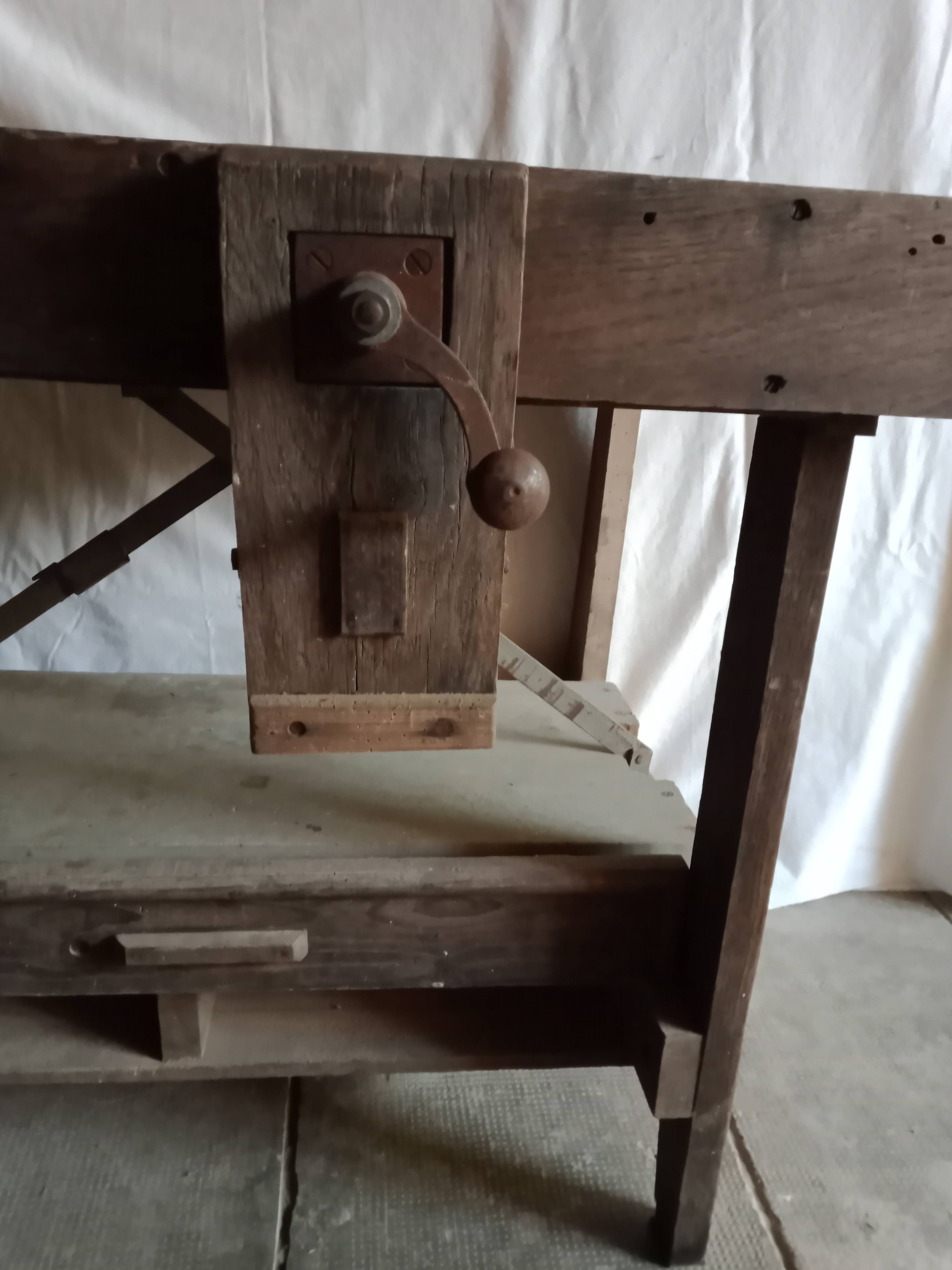 antique workbench with one drawer and two vices