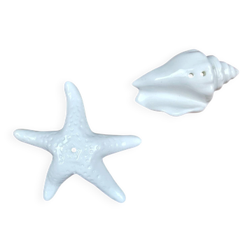 Set of shell and starfish salt and pepper shakers in white ceramic.