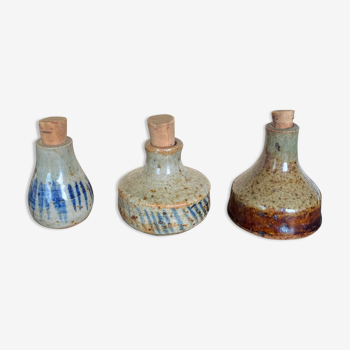 Trio of sandstone vials