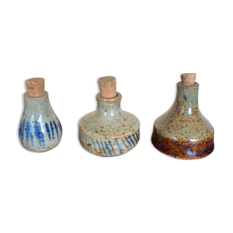 Trio of sandstone vials