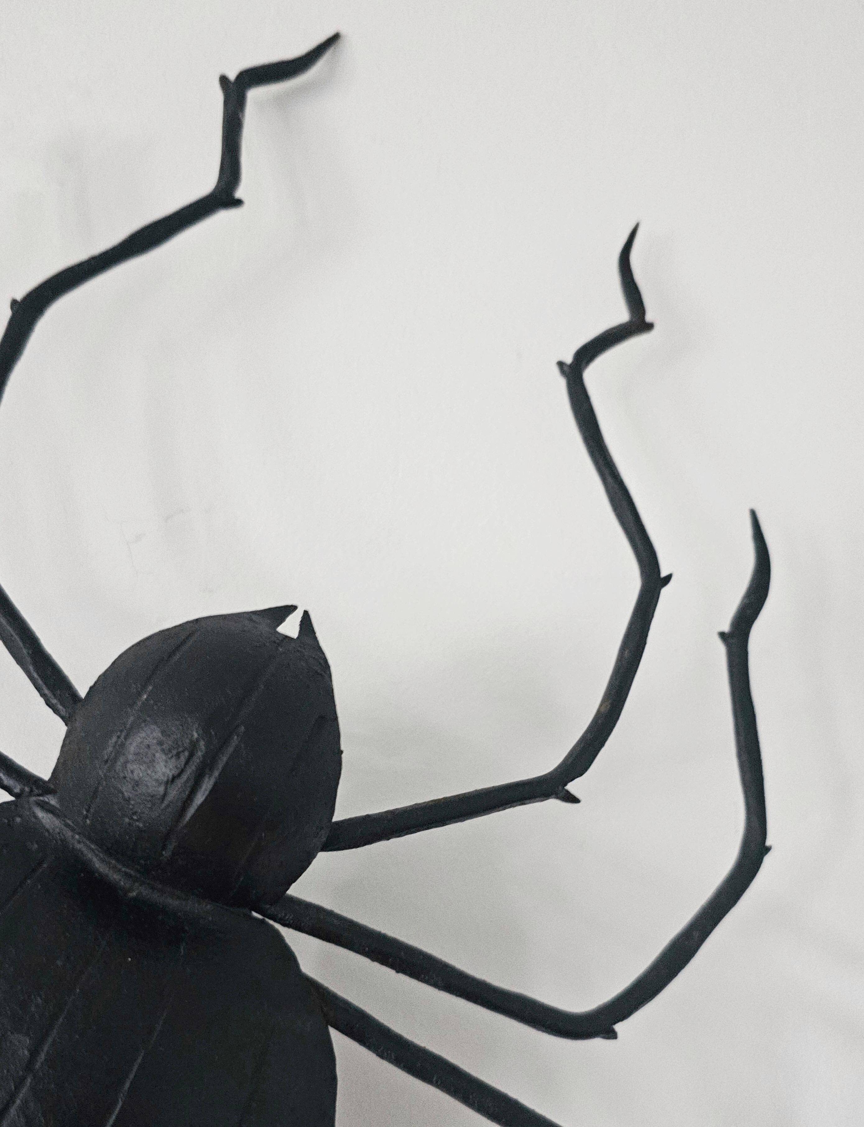Wall lamp in iron Mid Century Modern spider style from the 1960s.