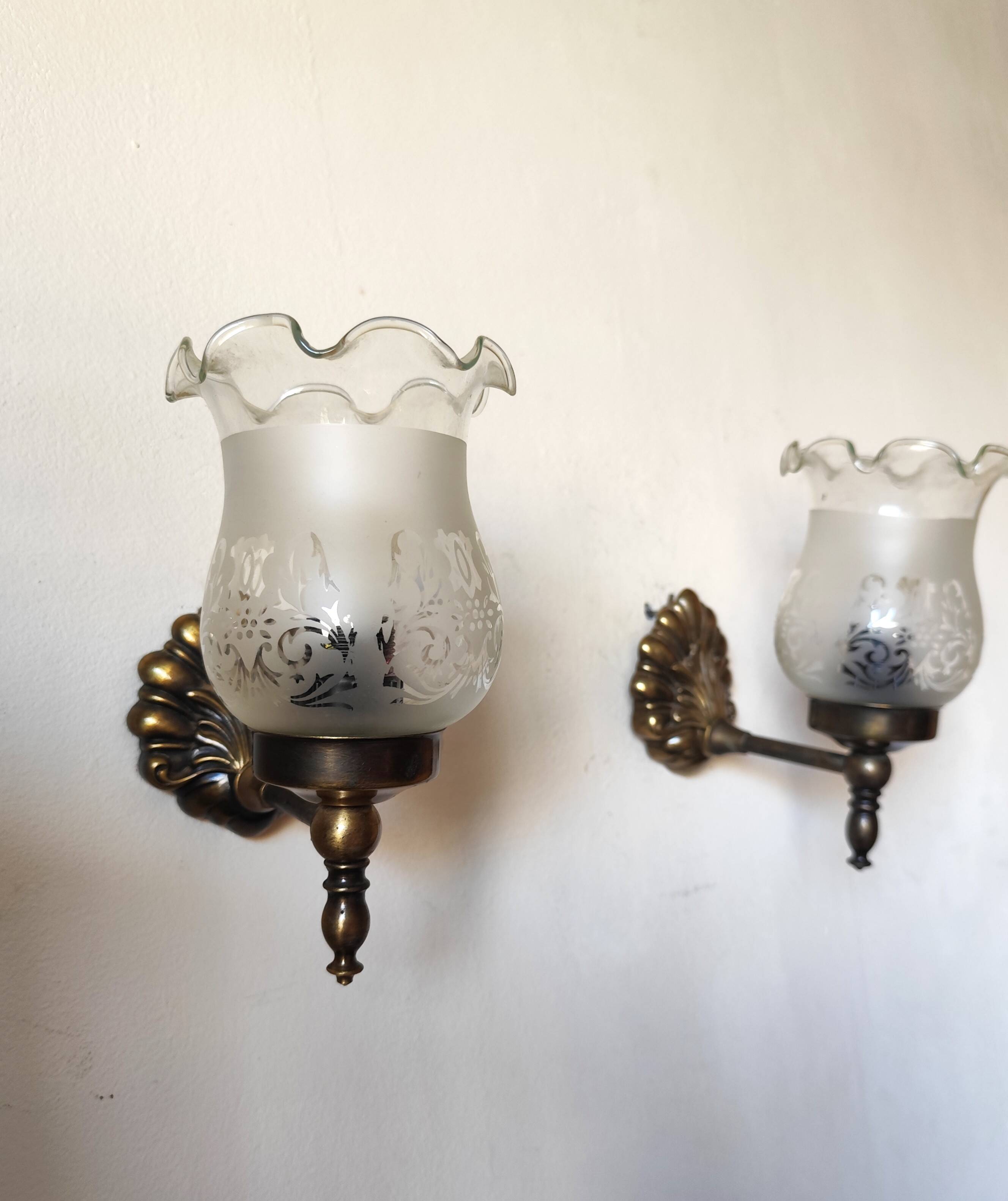 Pair of wall sconces in bronze with opaline glass tulips.