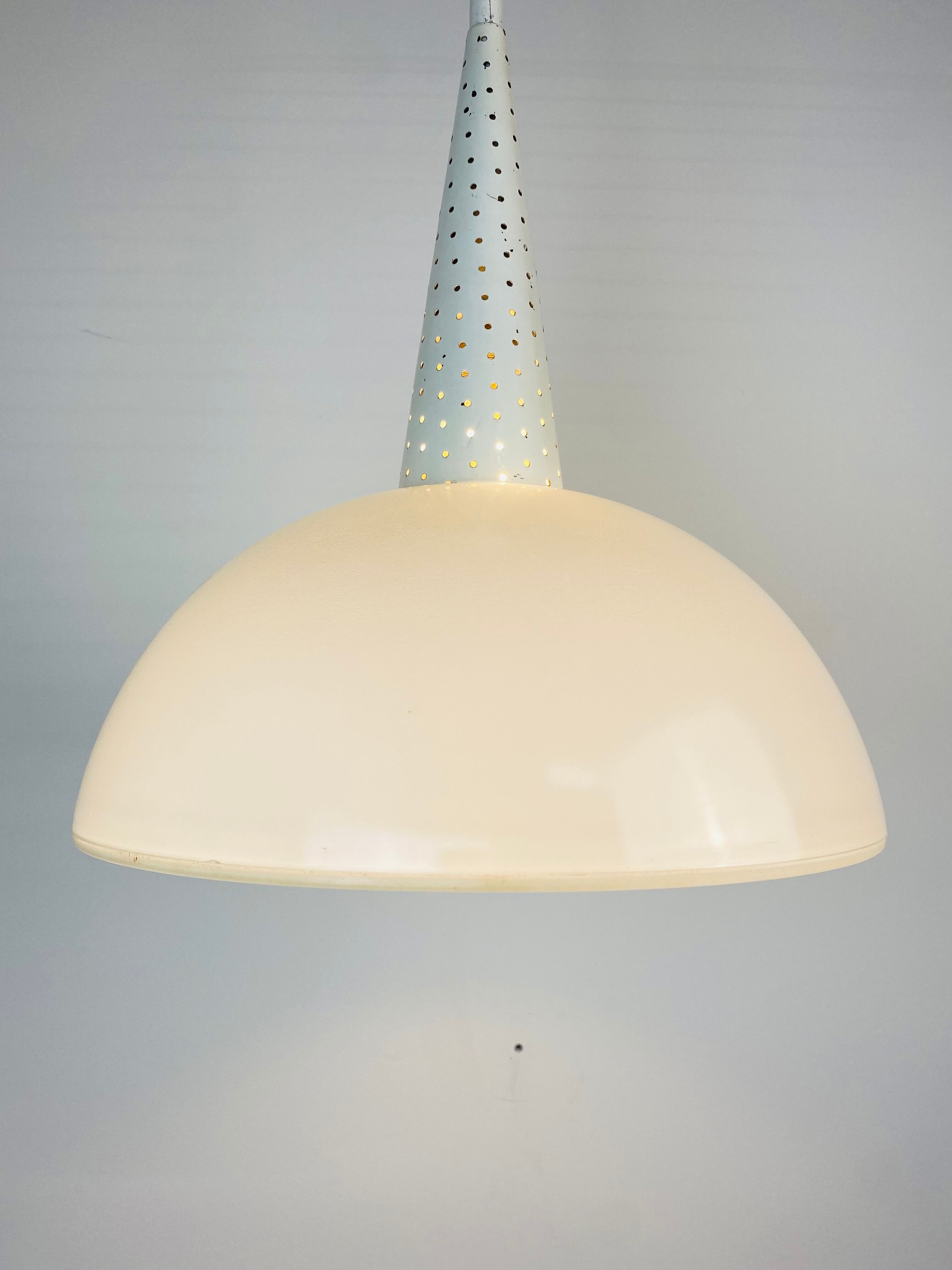 Perforated metal suspension holophanous glass