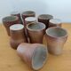 Stoneware cups – Armor stoneware set of 10 and an 11th French stoneware cup.