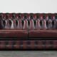 2.5-seater Chesterfield sofa in dark red flamed cowhide leather