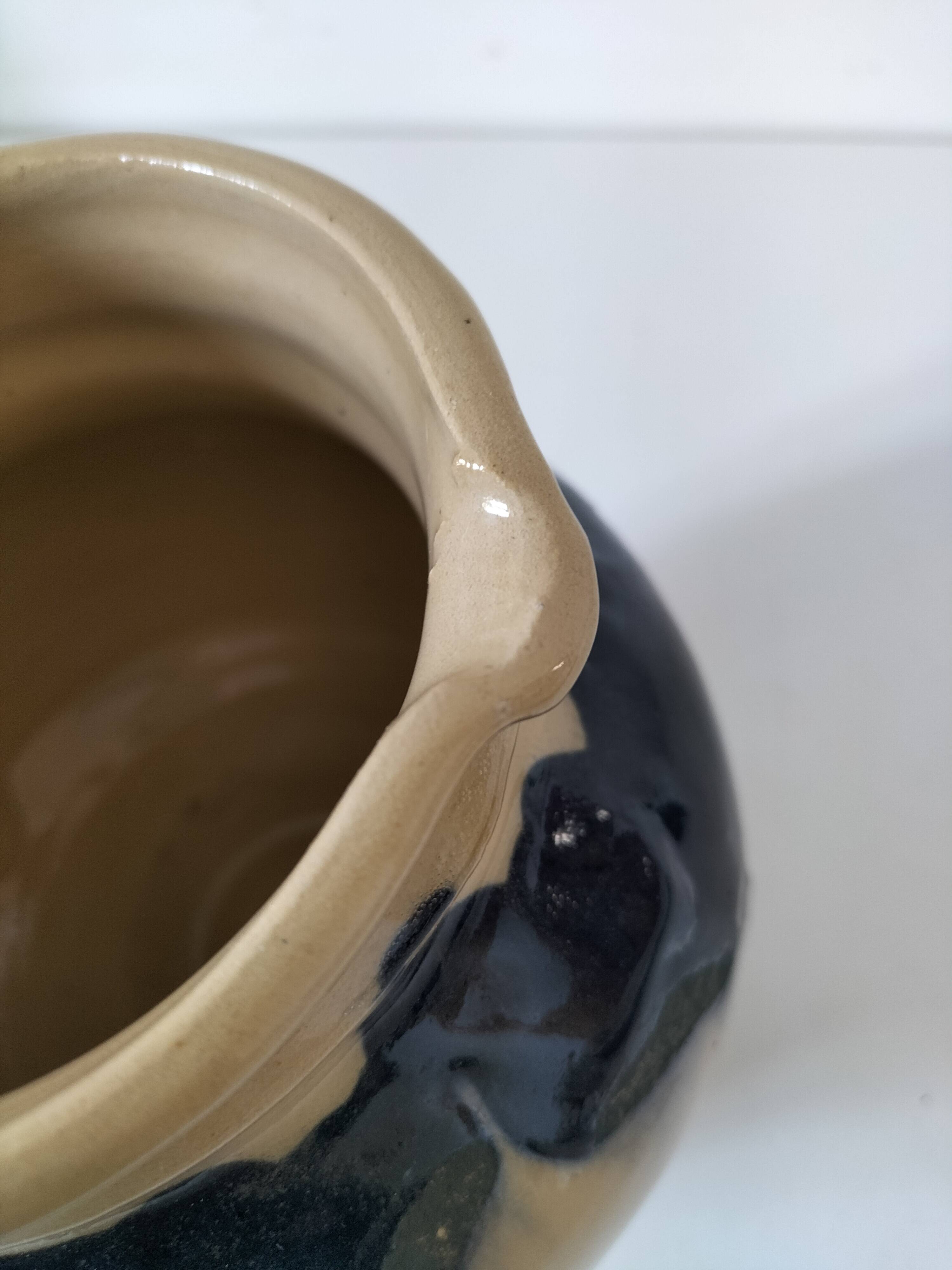 handcrafted ceramic jug with navy blue drip glaze.