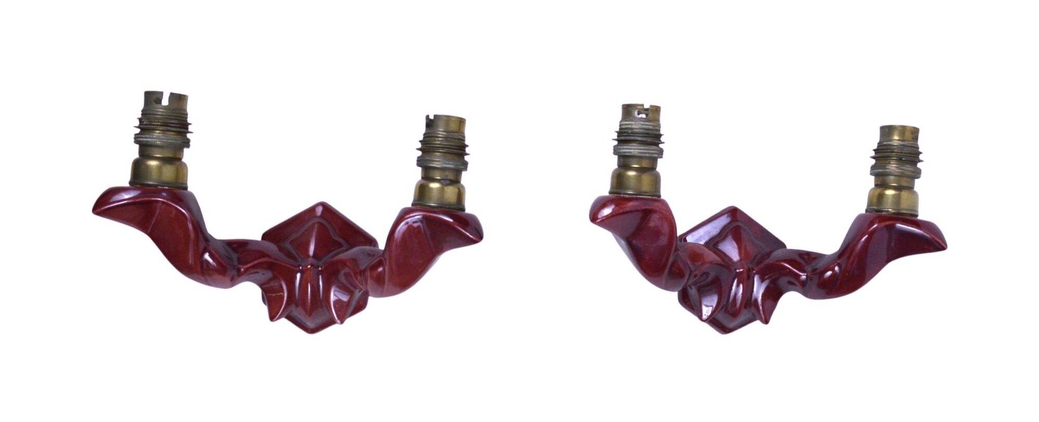 Pair of art deco wall lights in carmine red / burgundy earthenware.