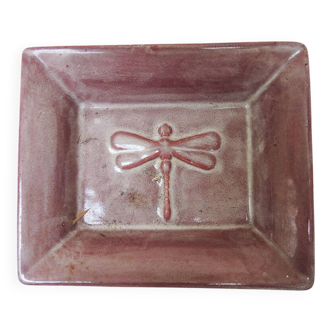 Old purple ceramic ashtray with dragonfly decoration.