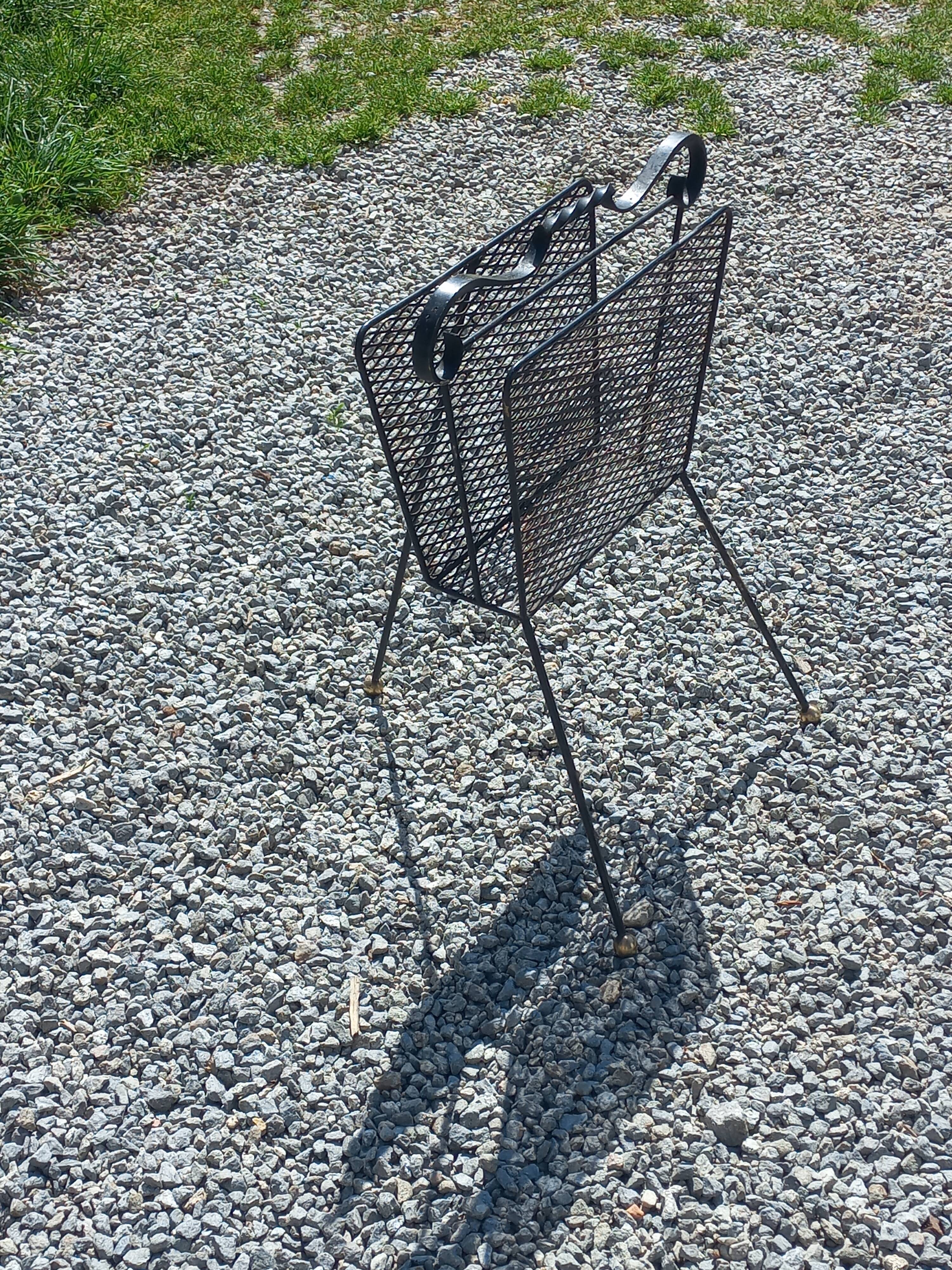 Perforated metal magazine rack from the 1960s.