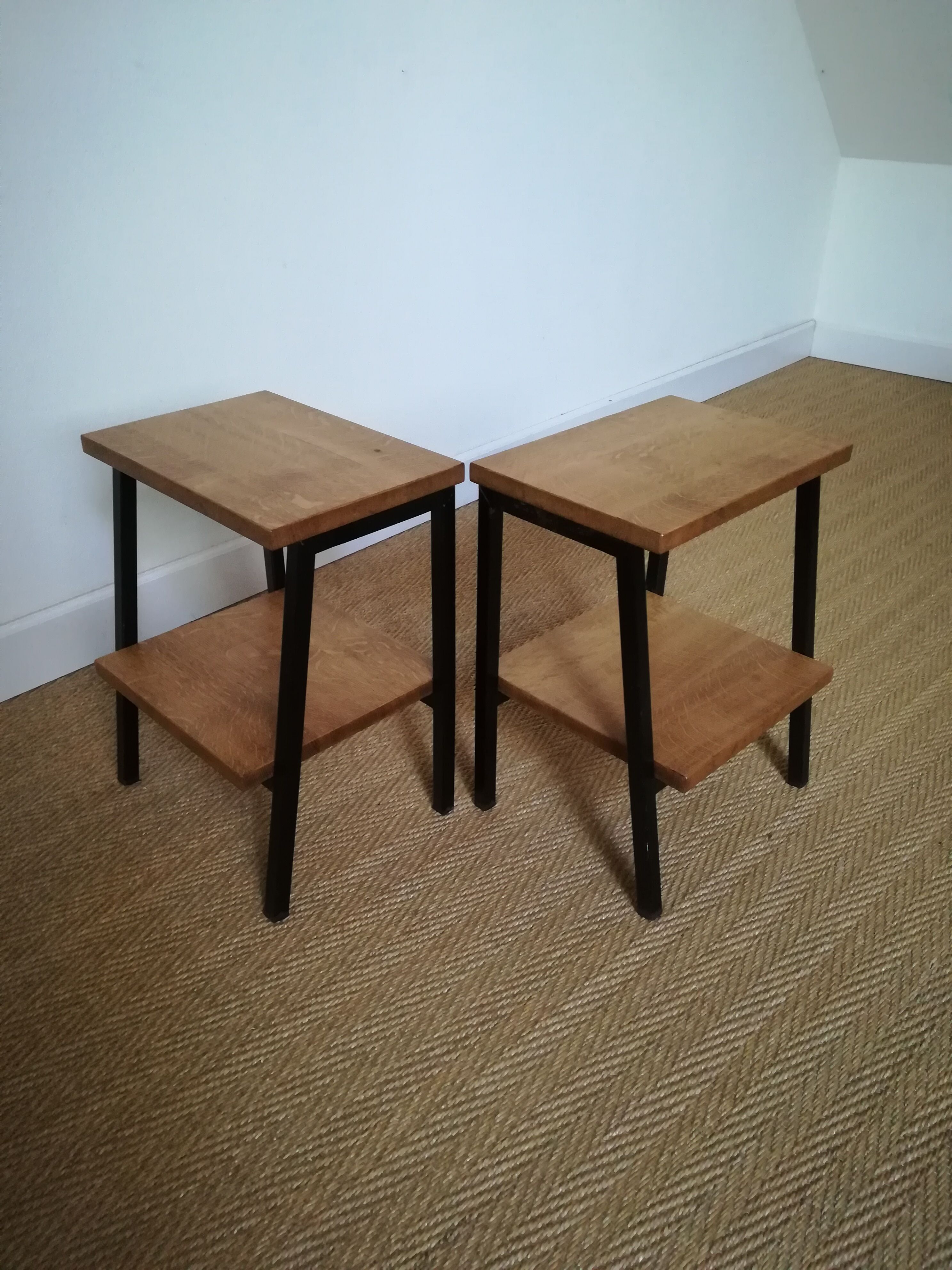 A pair of bedside tables