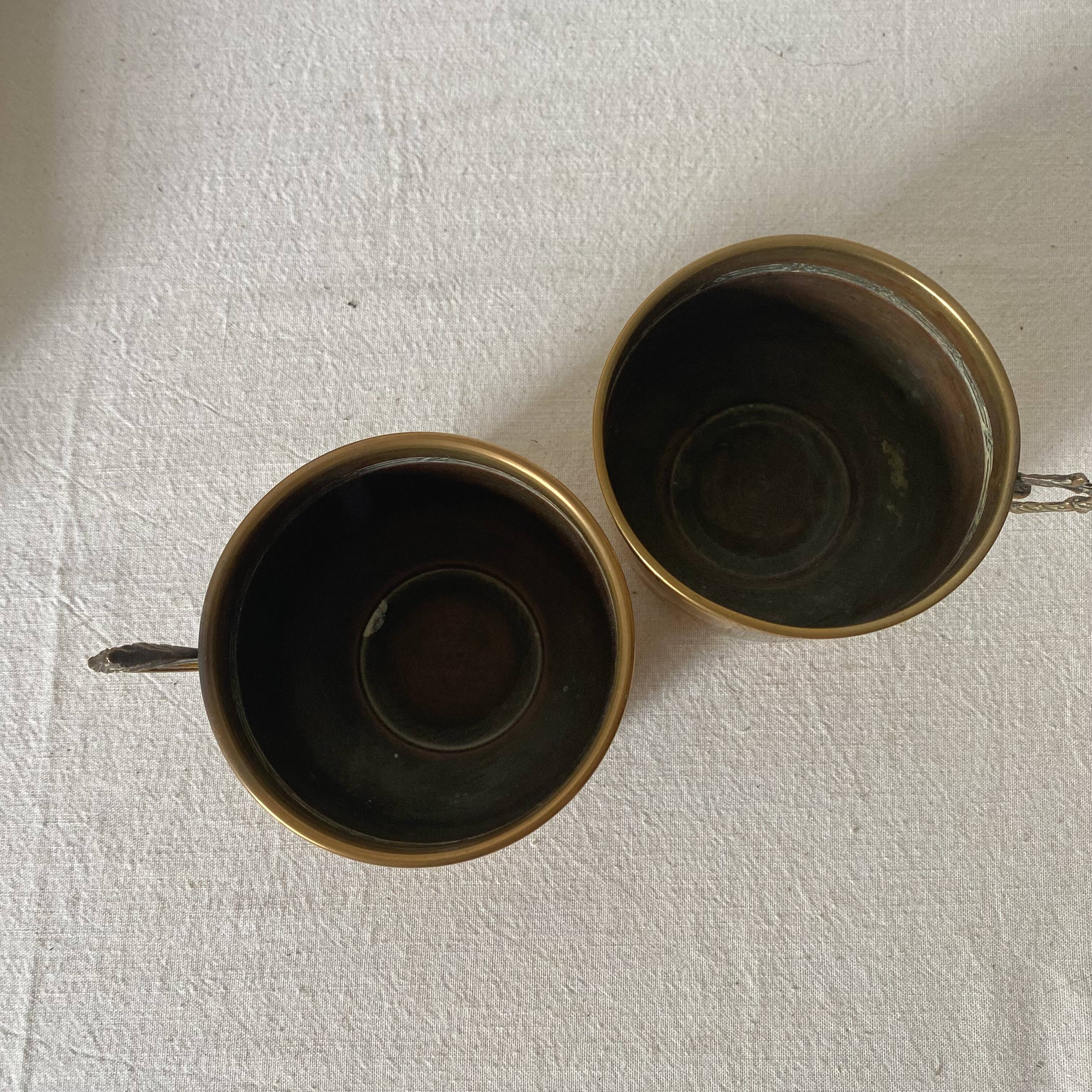 Antique brass cups