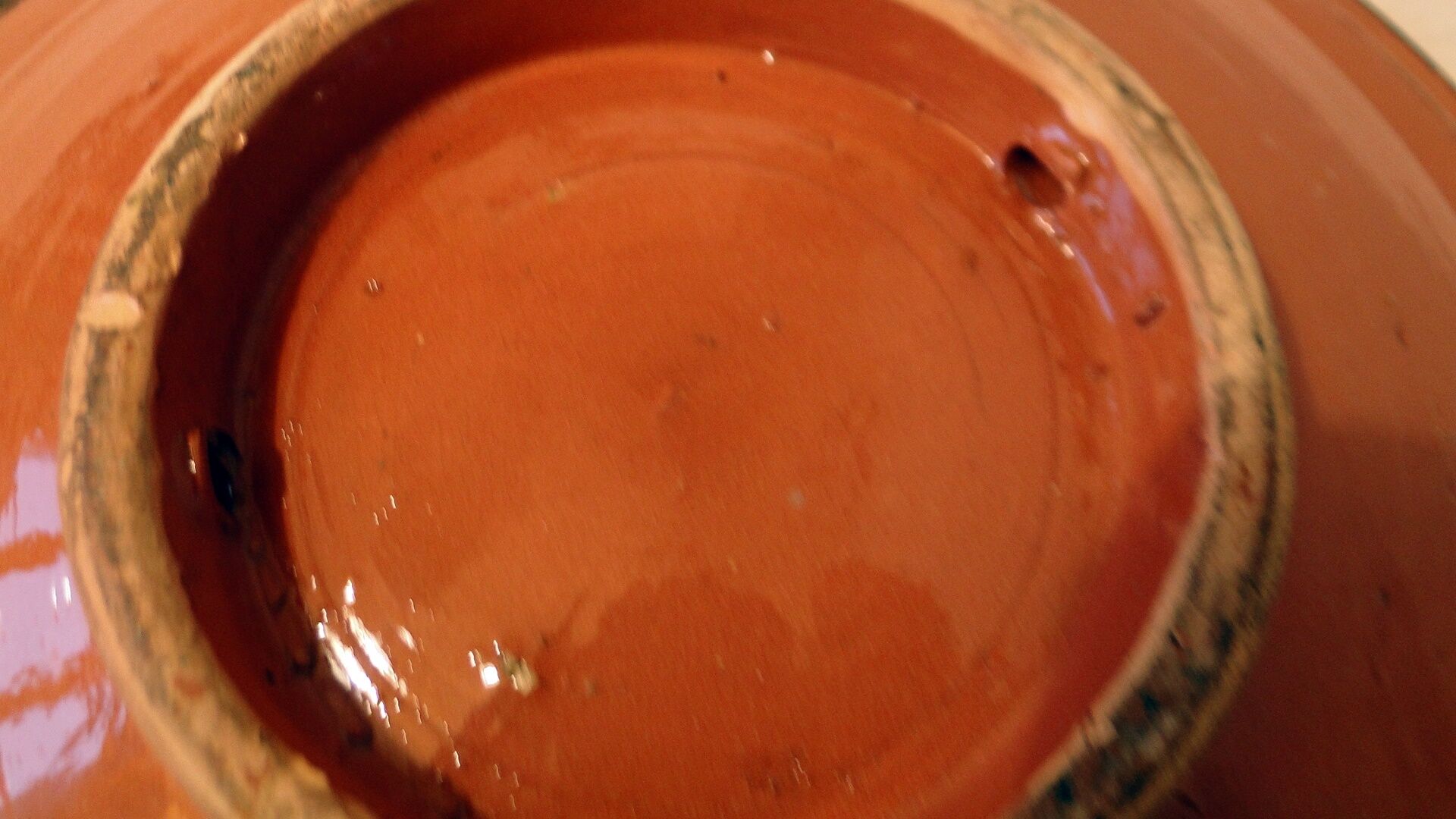 Hollow glazed terracotta dish with oriental decor to hang