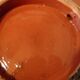Hollow glazed terracotta dish with oriental decor to hang