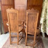 Pair of Renaissance style carved walnut armchairs