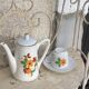 Porcelain dinette for dolls consisting of a coffee maker, cups and saucers, vintage