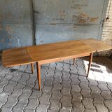 Extendable teak dining table