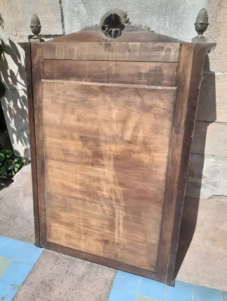 Antique carved mirror with a grey-green patina, Louis XVI style.