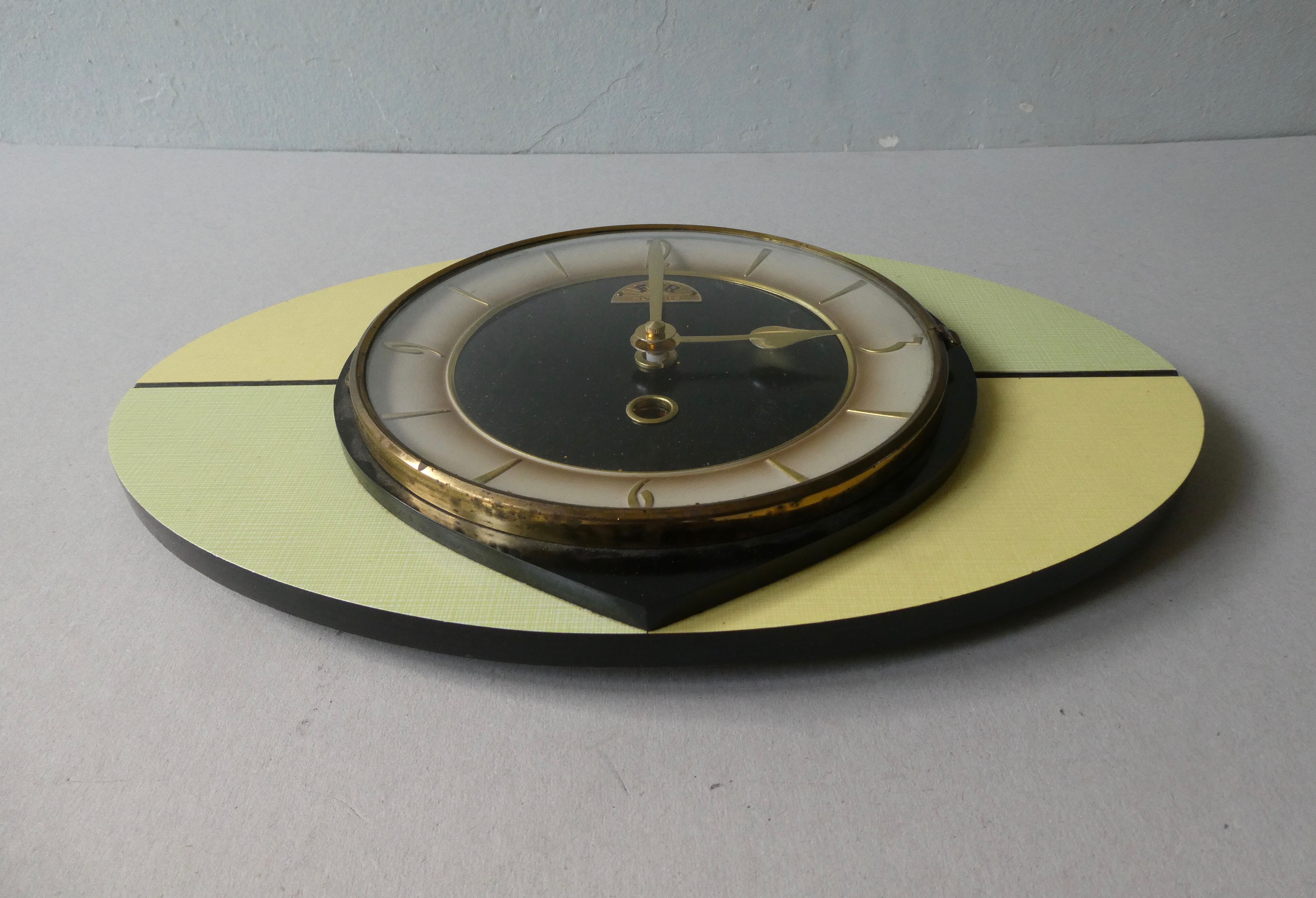 Ffr morbier clock from the 50s, in two-tone formica