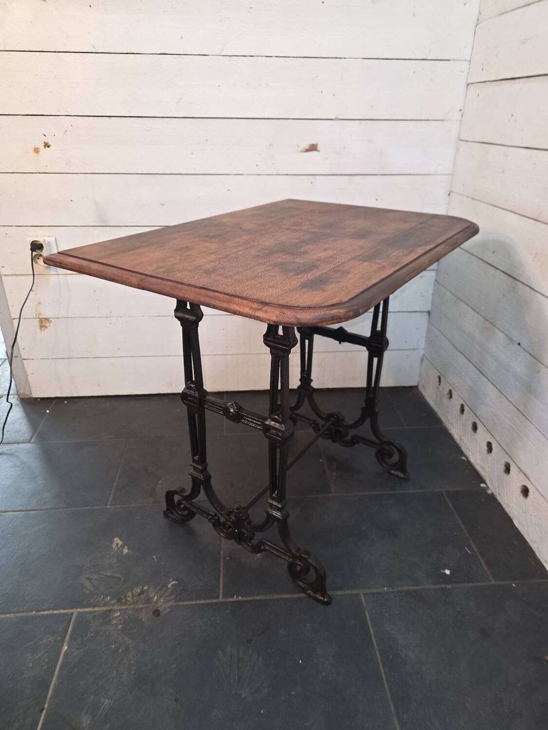 Bistro table with cast iron legs and oak top
