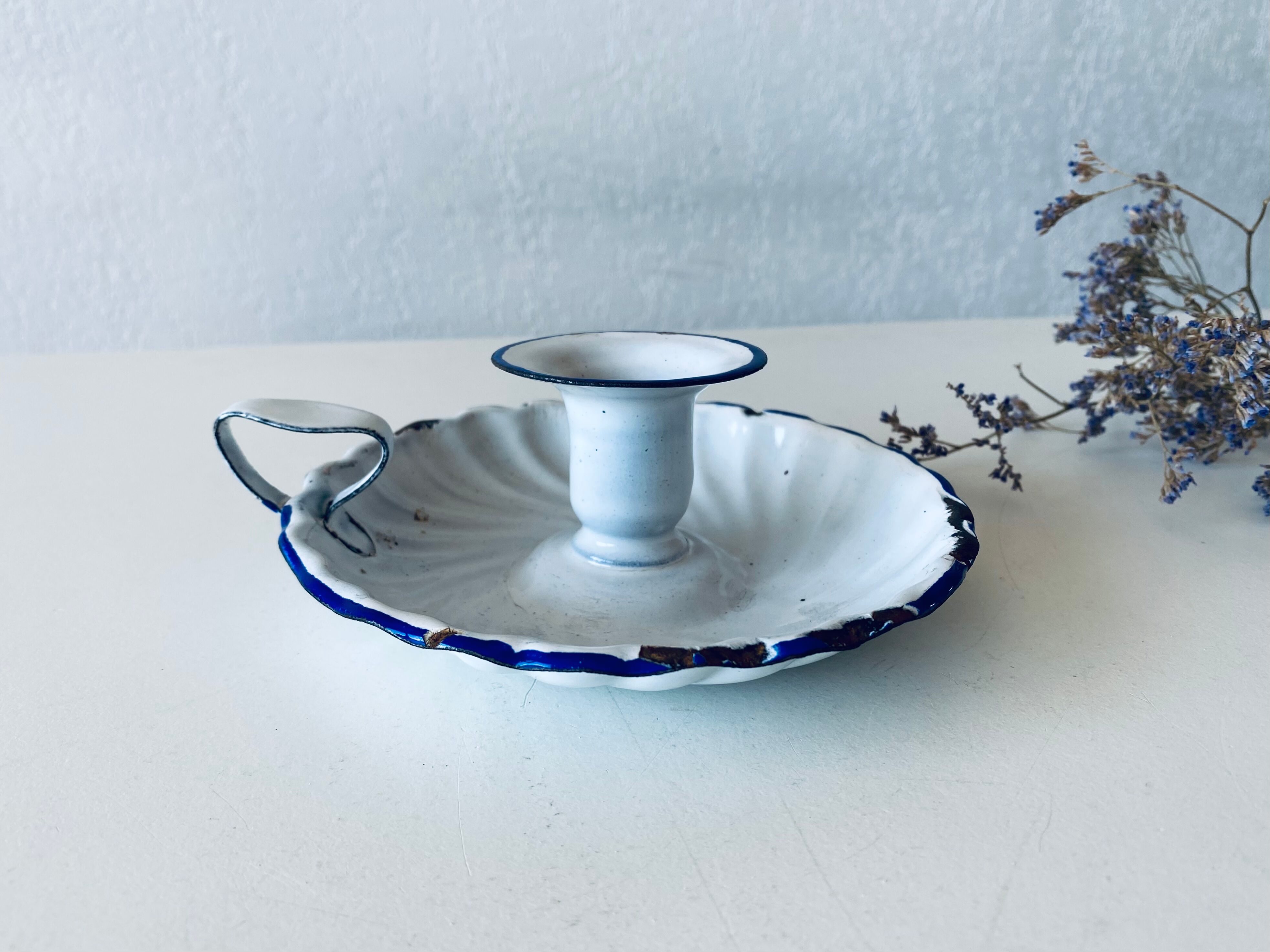 Antique candle holder in white and blue enamelled metal