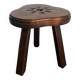 Tabouret tripode en bois sculpté