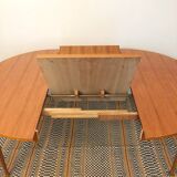 Round table with butterfly extension