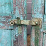 Pair of old wooden shutters green mint color