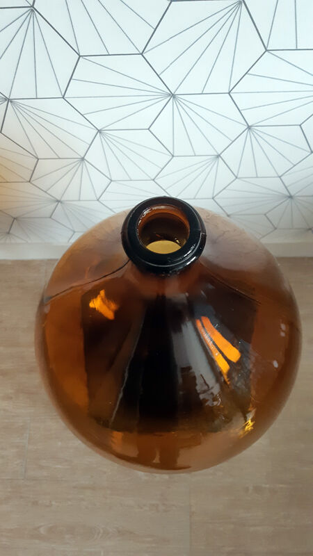 Great old demijohn in amber glass