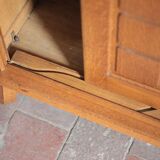 Vintage wooden wardrobe with sliding doors.