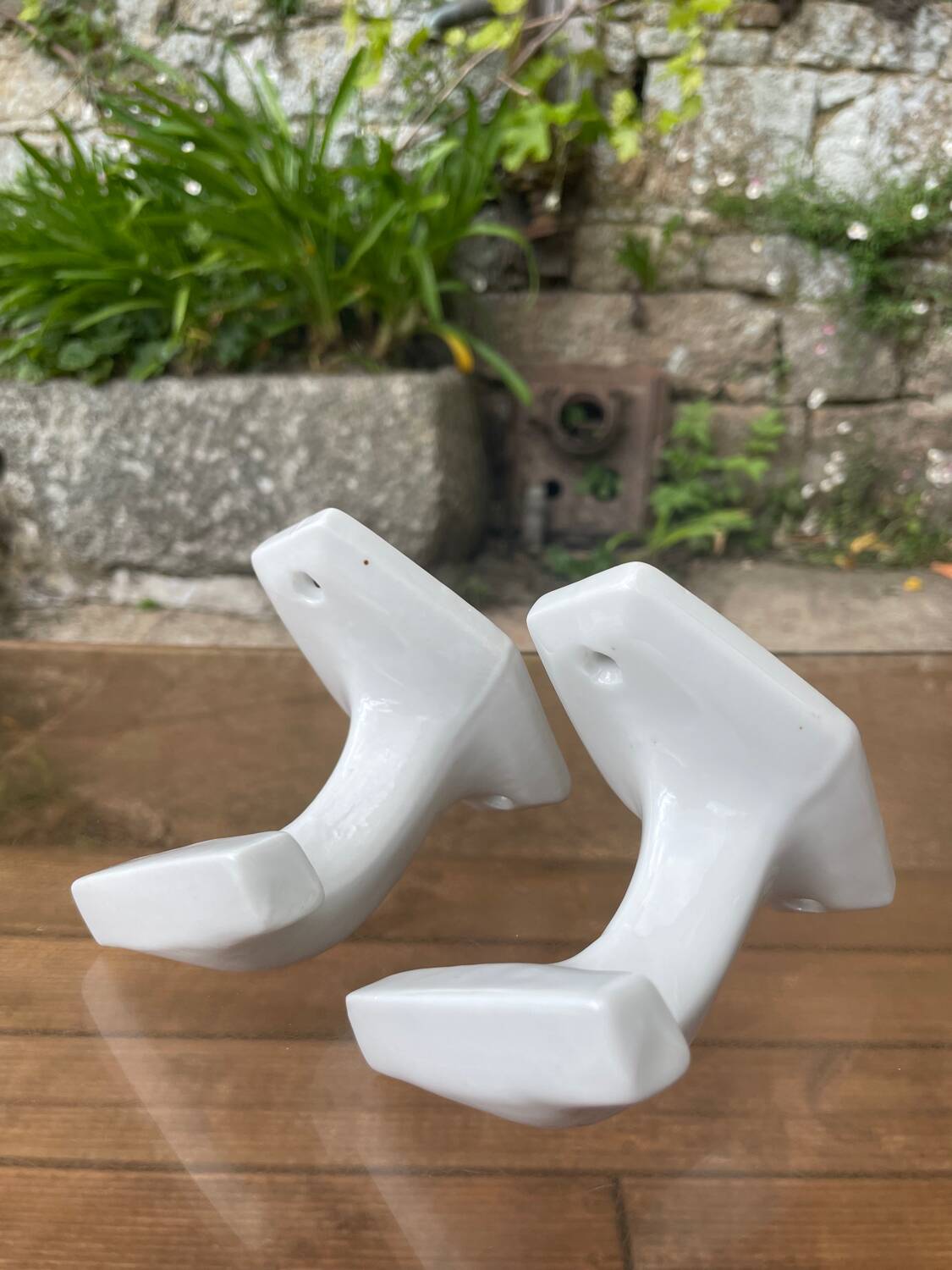 Duo of porcelain hooks