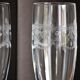 2 crystal champagne flutes of engraved arches