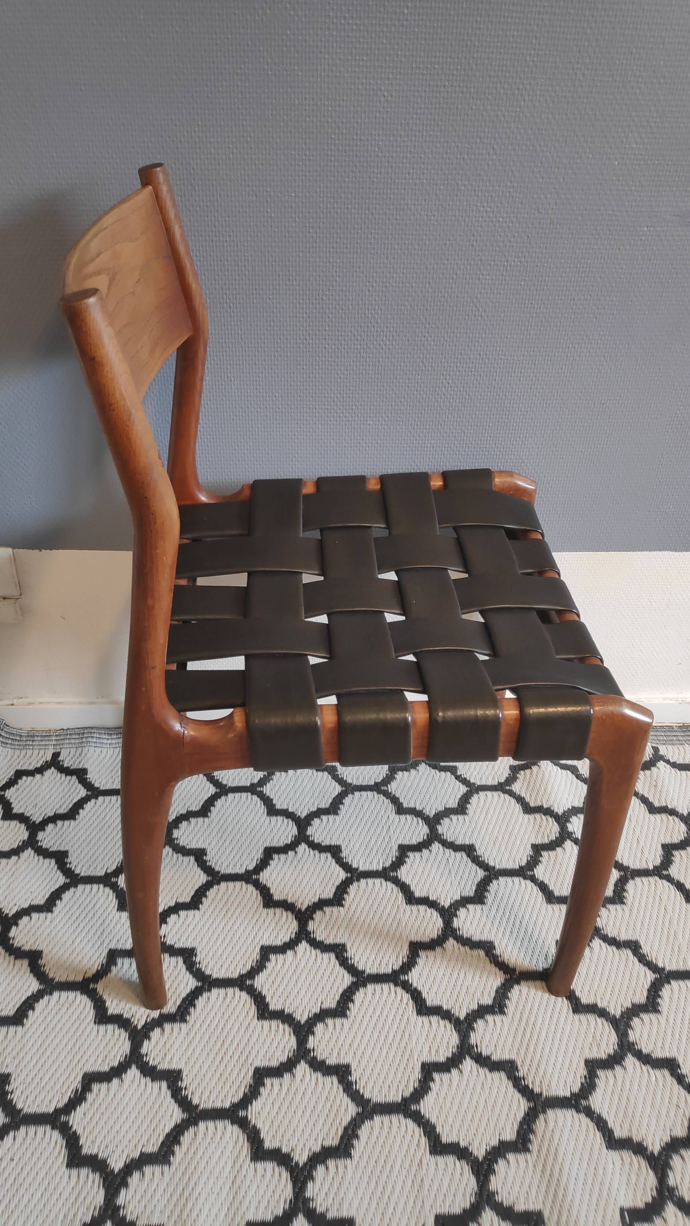 chair wooden structure and sitting with braiding of black skai strips