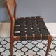 chair wooden structure and sitting with braiding of black skai strips