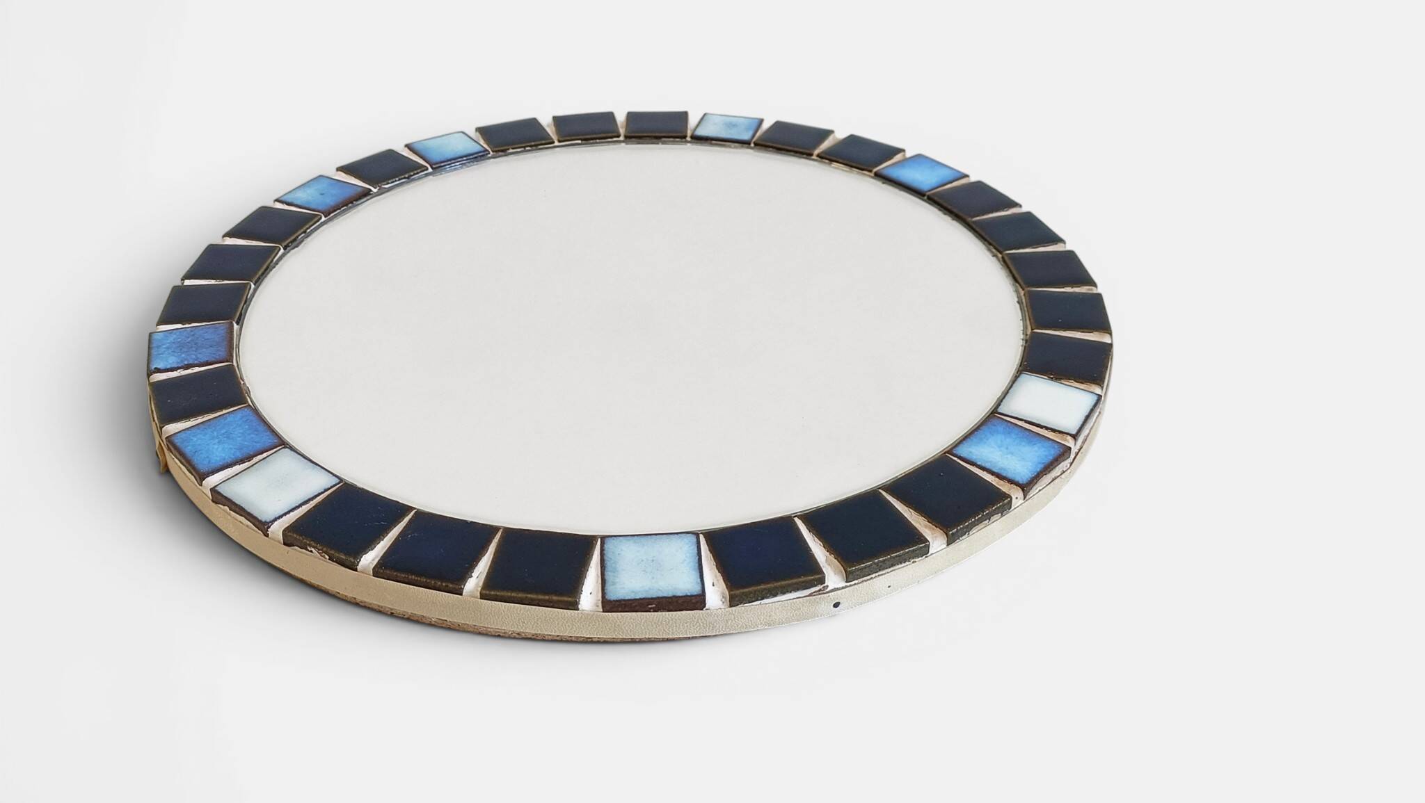 Round mosaic mirror in the style of Vallauris, France circa 1970.