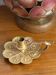 Handheld candlestick in bronze, card game decoration