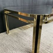 Vintage 1970s coffee table in gold metal and smoked glass.